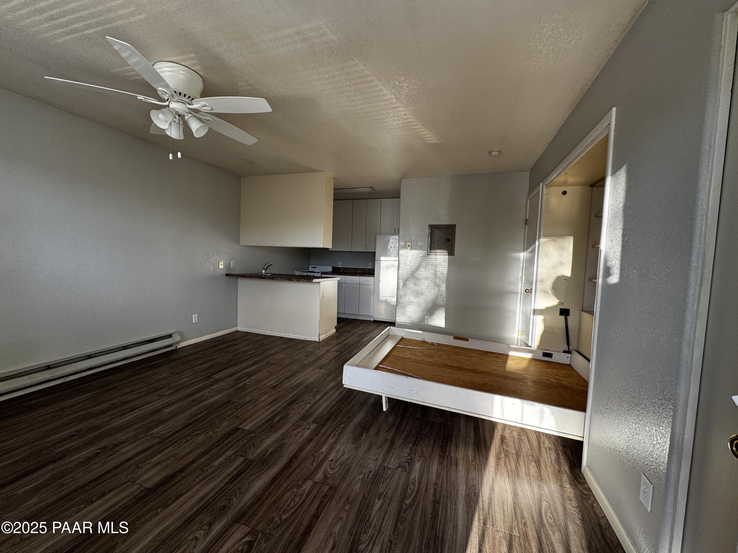 4873 North Judy Court, Unit C Prescott Valley, AZ 86314 - Photo 6 of 6 a view of living room with wooden floor and ceiling fan