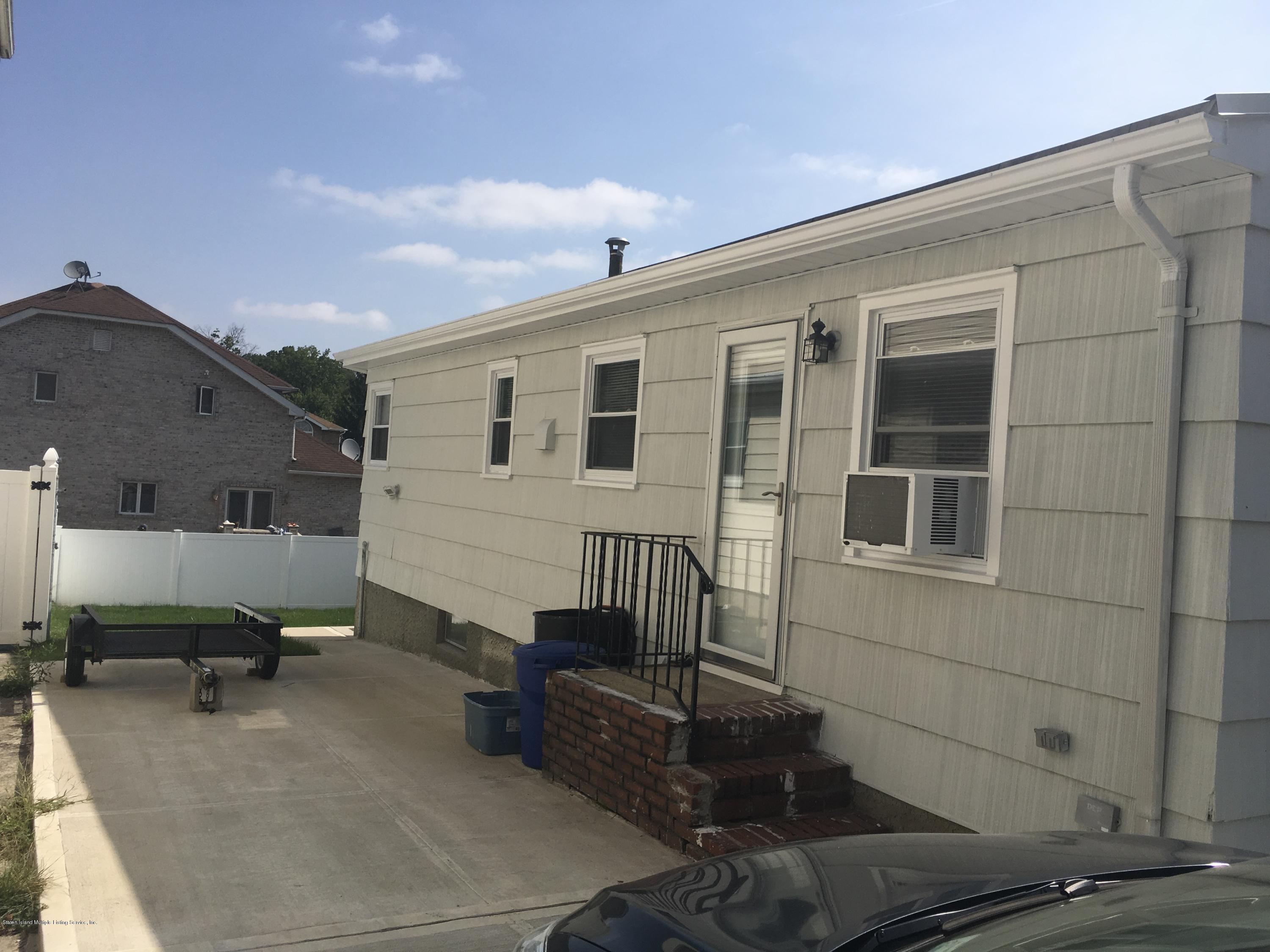 293 Beach Road Staten Island, NY 10312 - Photo 22 of 22 DRIVEWAY SIDE OF HOUSE