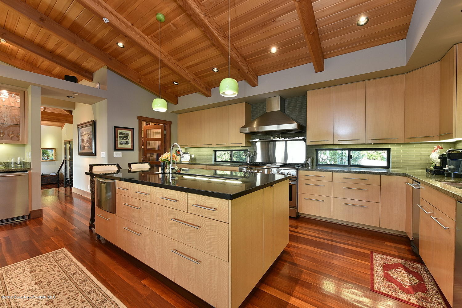 1825 Braemar Road Pasadena, CA 91103 - Photo 13 of 82 a kitchen with stainless steel appliances granite countertop a sink and wooden cabinets