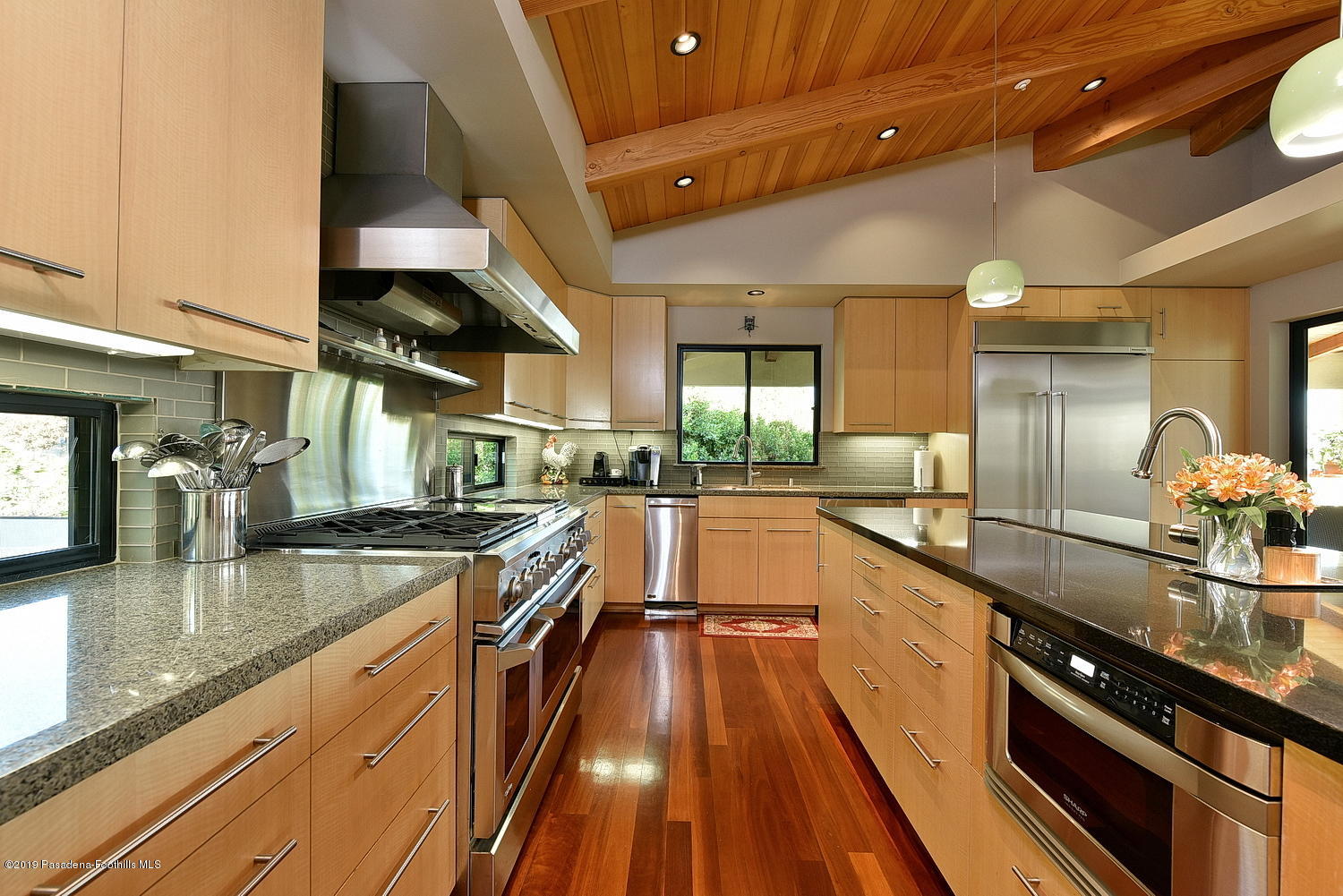 1825 Braemar Road Pasadena, CA 91103 - Photo 14 of 82 a large kitchen with stainless steel appliances granite countertop a lot of counter space and wooden floors