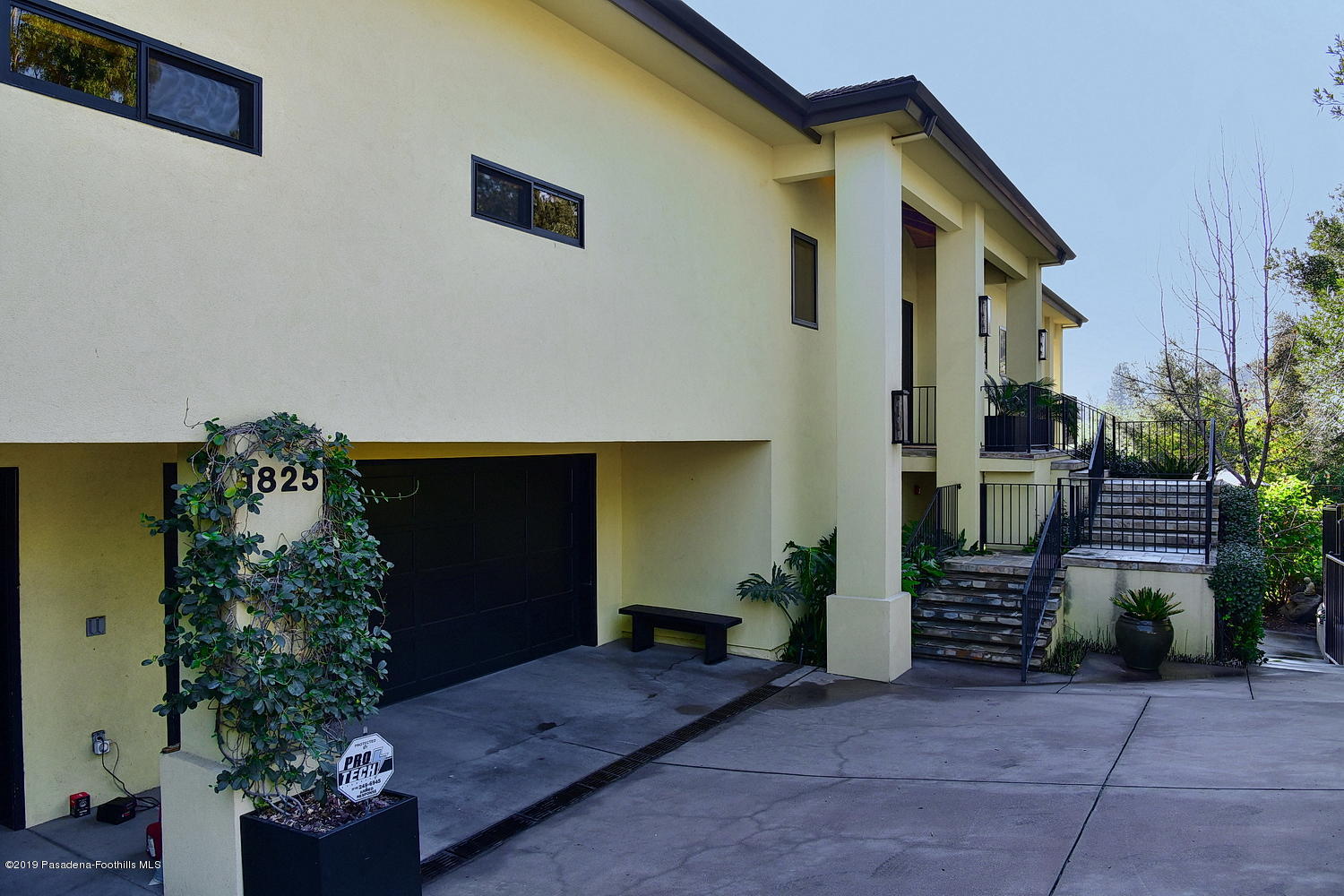 1825 Braemar Road Pasadena, CA 91103 - Photo 2 of 82 a front view of a house with a garden