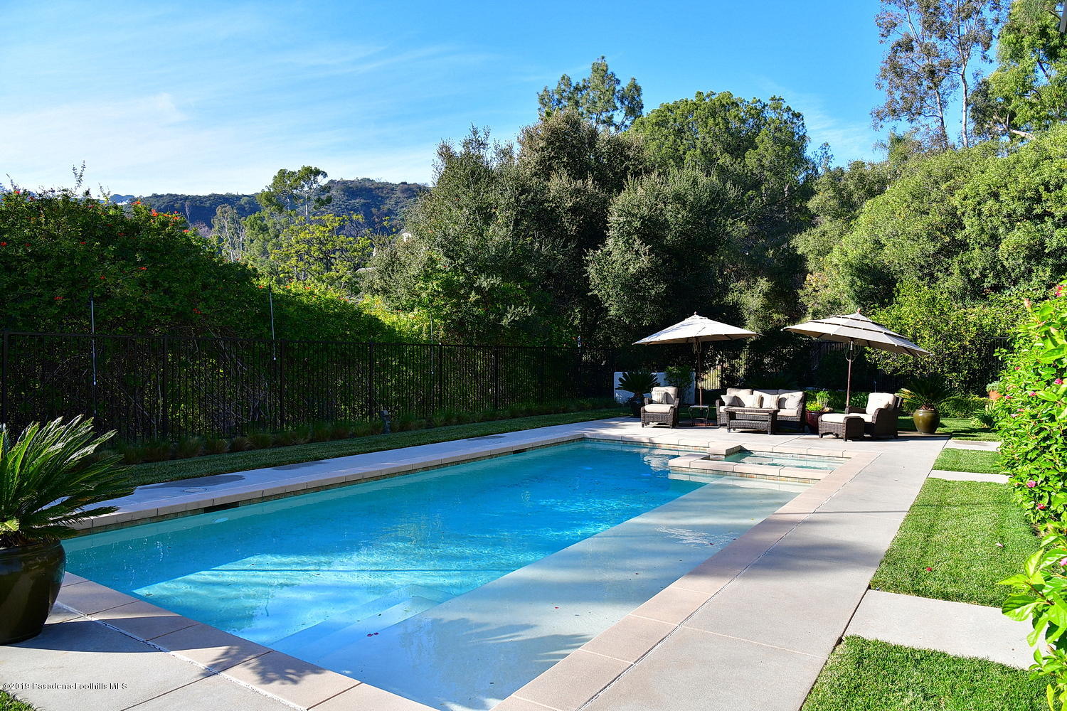 1825 Braemar Road Pasadena, CA 91103 - Photo 46 of 82 a view of a swimming pool with a patio