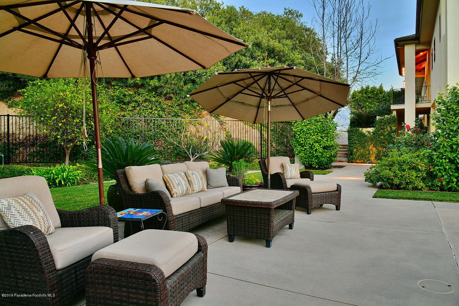 1825 Braemar Road Pasadena, CA 91103 - Photo 68 of 82 a view of a patio with couches under an umbrella