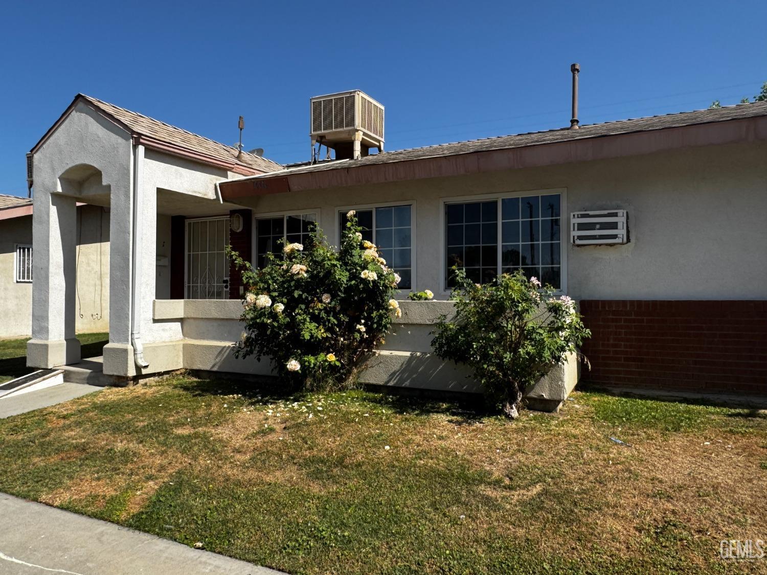 front view of a house with a small yard