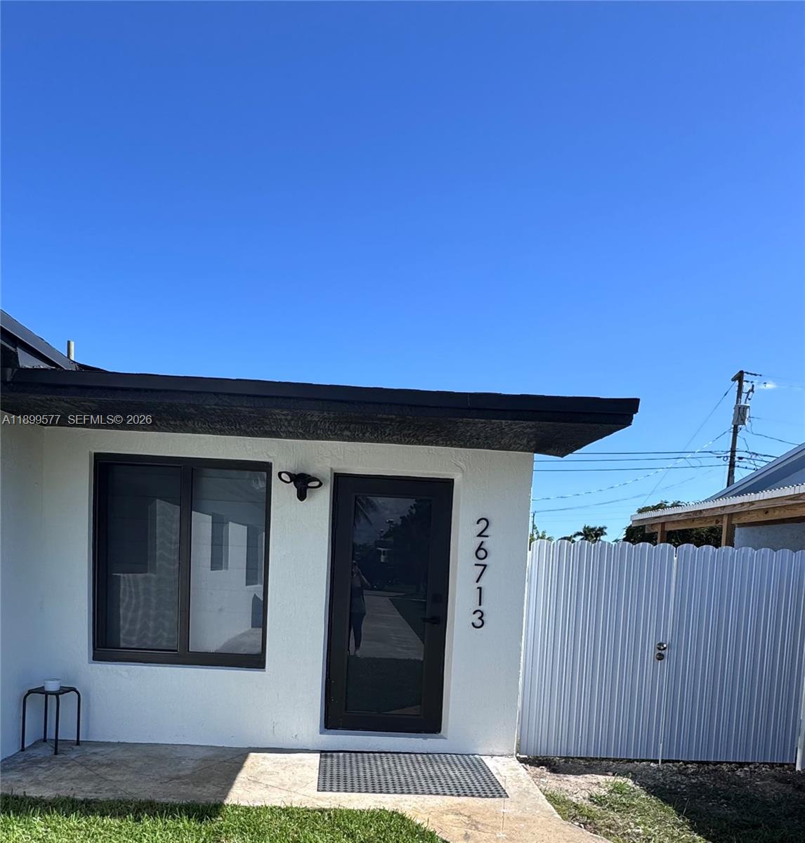 26711 Southwest 145th Avenue Road Homestead, FL 33032 - Photo 21 of 21 a front view of a house with a garden
