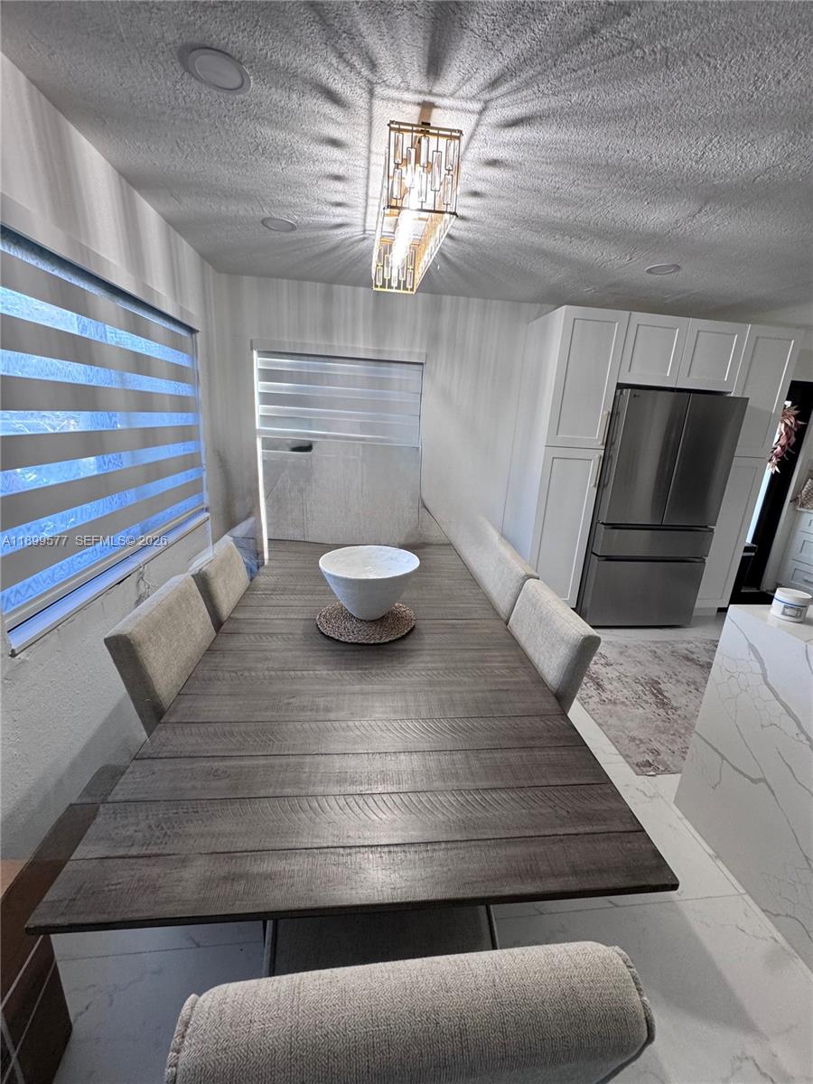 26711 Southwest 145th Avenue Road Homestead, FL 33032 - Photo 8 of 21 a living room with furniture and wooden floor