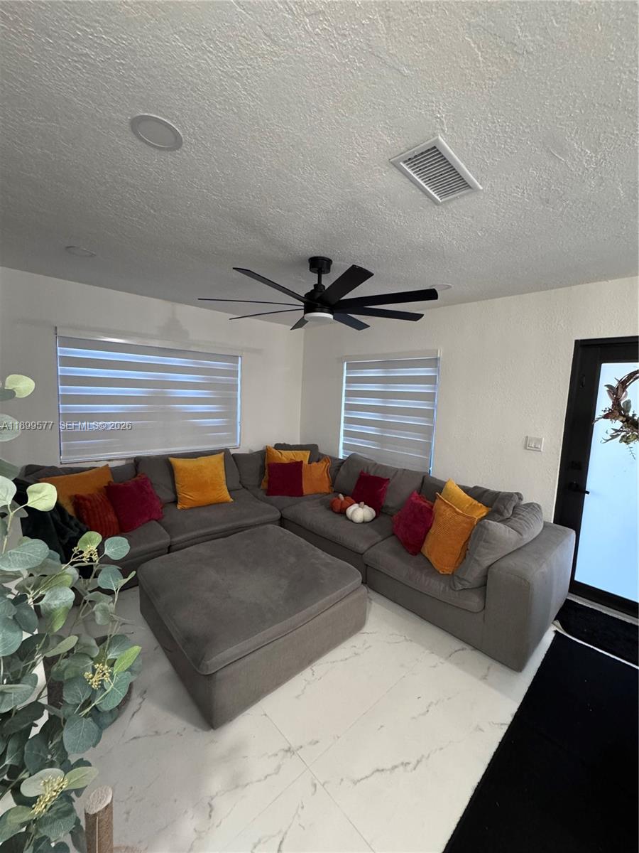 26711 Southwest 145th Avenue Road Homestead, FL 33032 - Photo 10 of 21 a living room with furniture