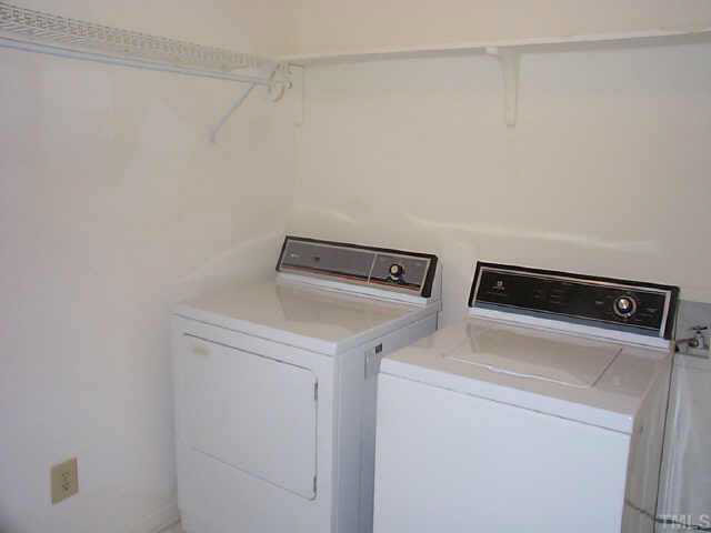 728 Red Forest Trail Raleigh, NC 27615 - Photo 6 of 8 a utility room with dryer and washer