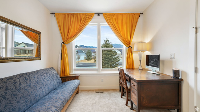 1238 Canyon View Road Midway, UT 84049 - Photo 13 of 36 Bright interior space featuring a double window, light-toned walls, and soft carpeting