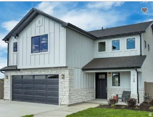 2199 West 2575th North, Unit 121 Clinton, UT 84015 - Photo 1 of 6 Contemporary two-story residence featuring white board and batten siding with a dark asphalt shingle roof. Home is TO BE BUILT. Pictures are of a similar model.