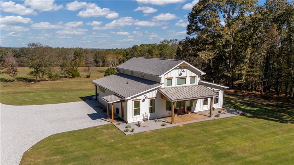 196 Frank Brown Road Maysville, GA 30558 - Photo 3 of 66 an aerial view of a house with a garden