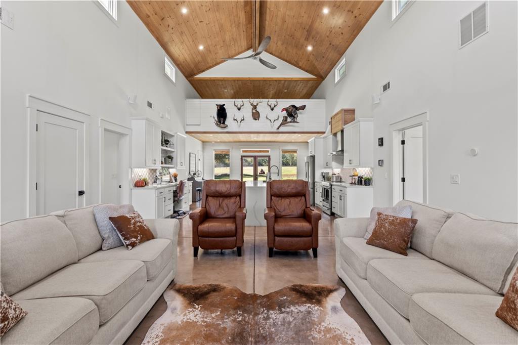 196 Frank Brown Road Maysville, GA 30558 - Photo 41 of 66 a living room with furniture and a chandelier