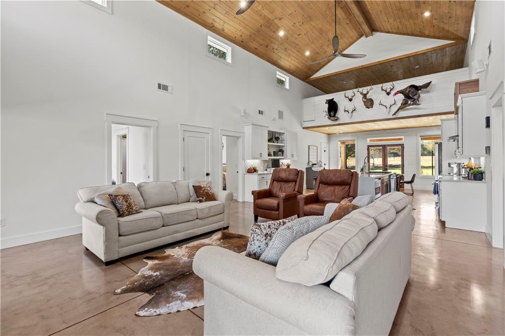 196 Frank Brown Road Maysville, GA 30558 - Photo 42 of 66 a living room with furniture and a large window