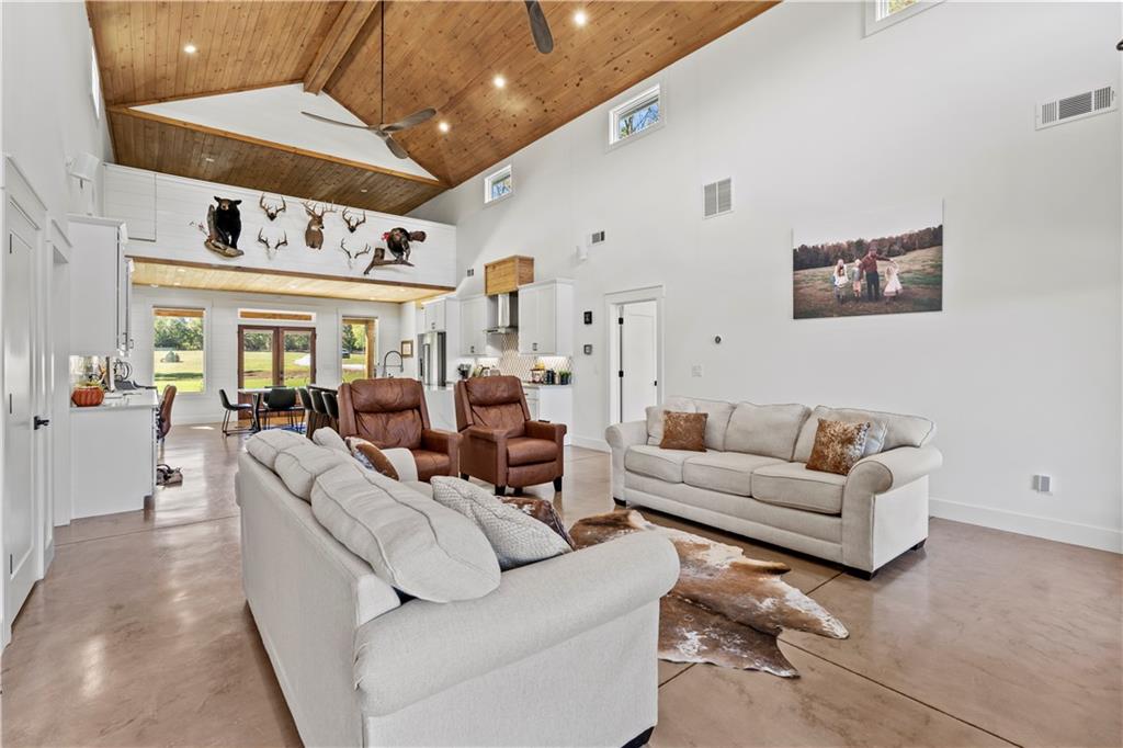 196 Frank Brown Road Maysville, GA 30558 - Photo 44 of 66 a living room with furniture and a large window