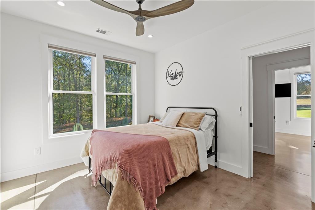 196 Frank Brown Road Maysville, GA 30558 - Photo 57 of 66 a bedroom with a bed and a window