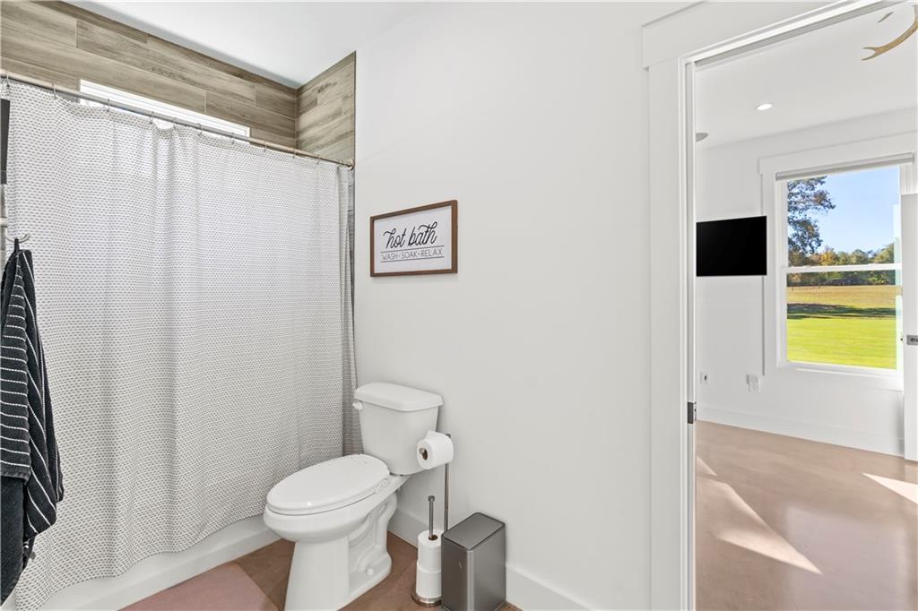 196 Frank Brown Road Maysville, GA 30558 - Photo 61 of 66 a bathroom with a toilet and a shower