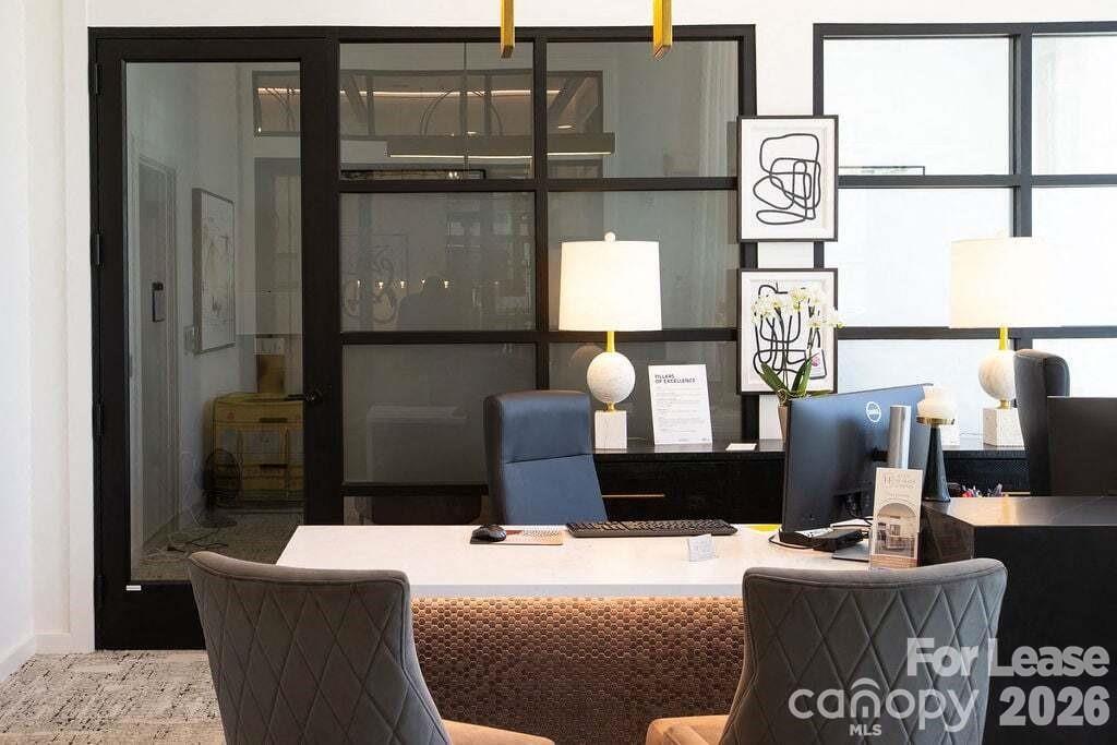 102 Kennedy Rdg Way, Unit GENE Mooresville, NC 28115 - Photo 12 of 37 a living room with couches painting on the wall and a potted plant