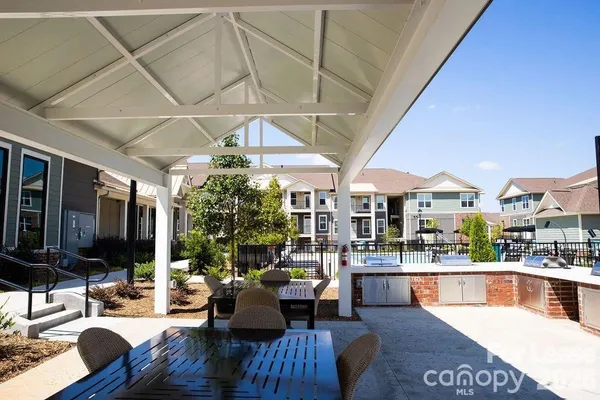 a view of a house with a swimming pool and a yard