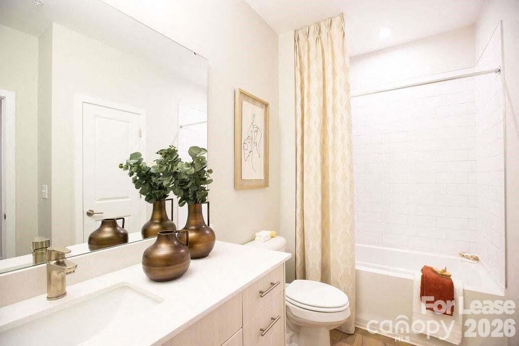 102 Kennedy Rdg Way, Unit GENE Mooresville, NC 28115 - Photo 32 of 37 a view of bathroom with a potted plant on the counter and toilet