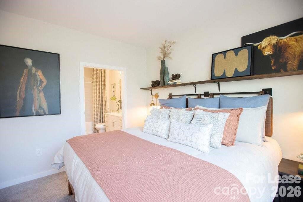 102 Kennedy Rdg Way, Unit GENE Mooresville, NC 28115 - Photo 33 of 37 a bedroom with a bed and painting on the wall