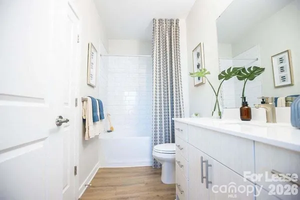 kids bedroom with furniture and a window