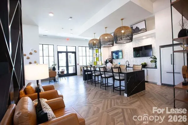 a living room with a table and a window