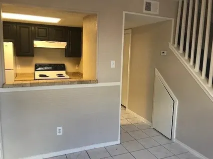 a view of a kitchen with a sink