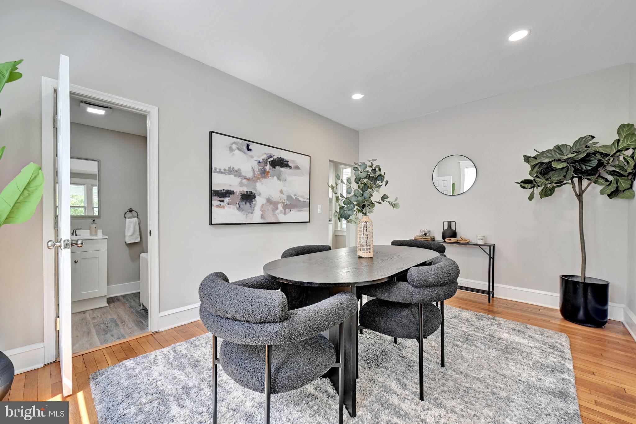3005 7th Street Southeast Washington, DC 20032 - Photo 11 of 56 a view of a livingroom with furniture and a dining table