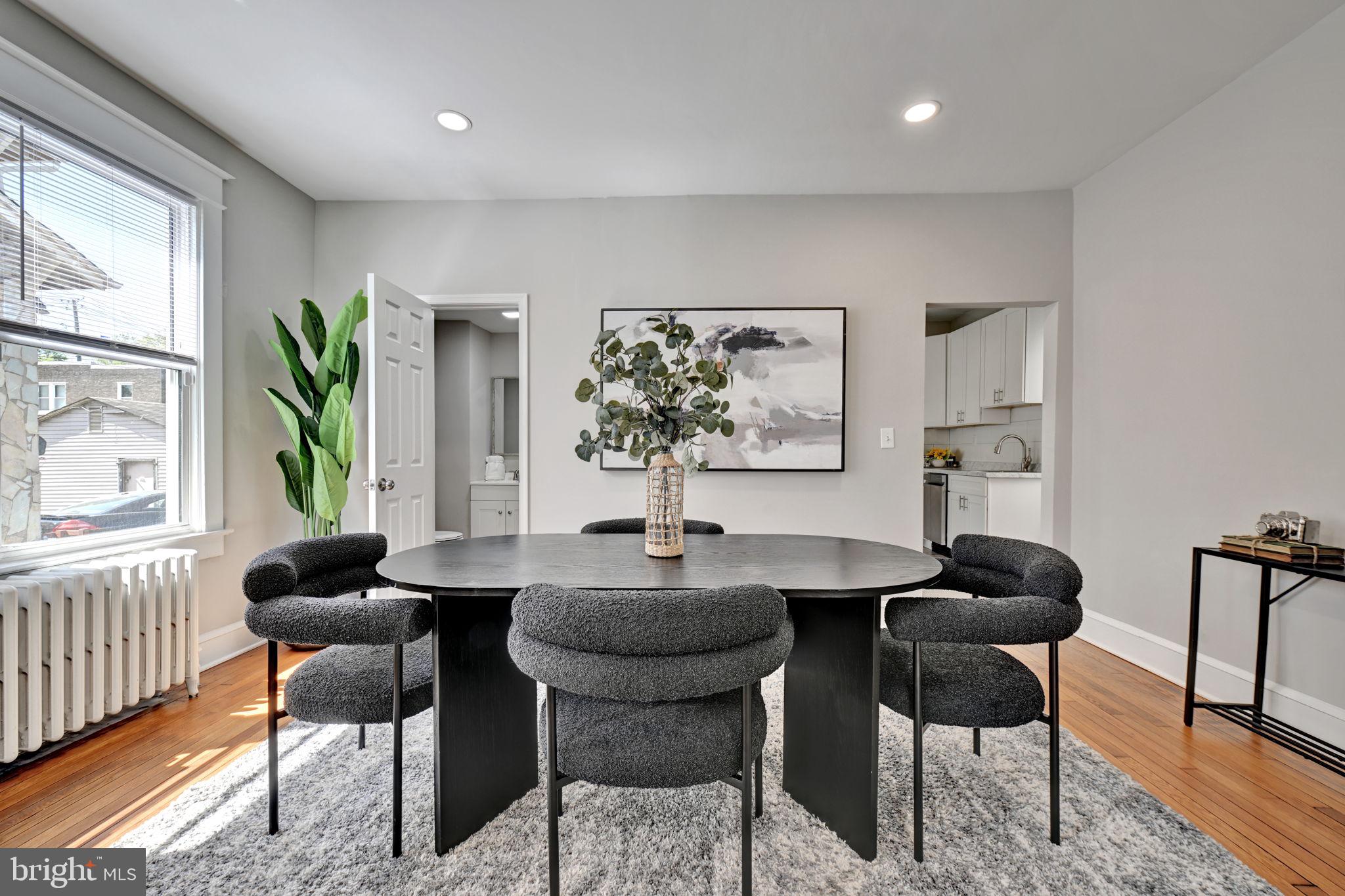 3005 7th Street Southeast Washington, DC 20032 - Photo 12 of 56 a workspace with furniture and a large window