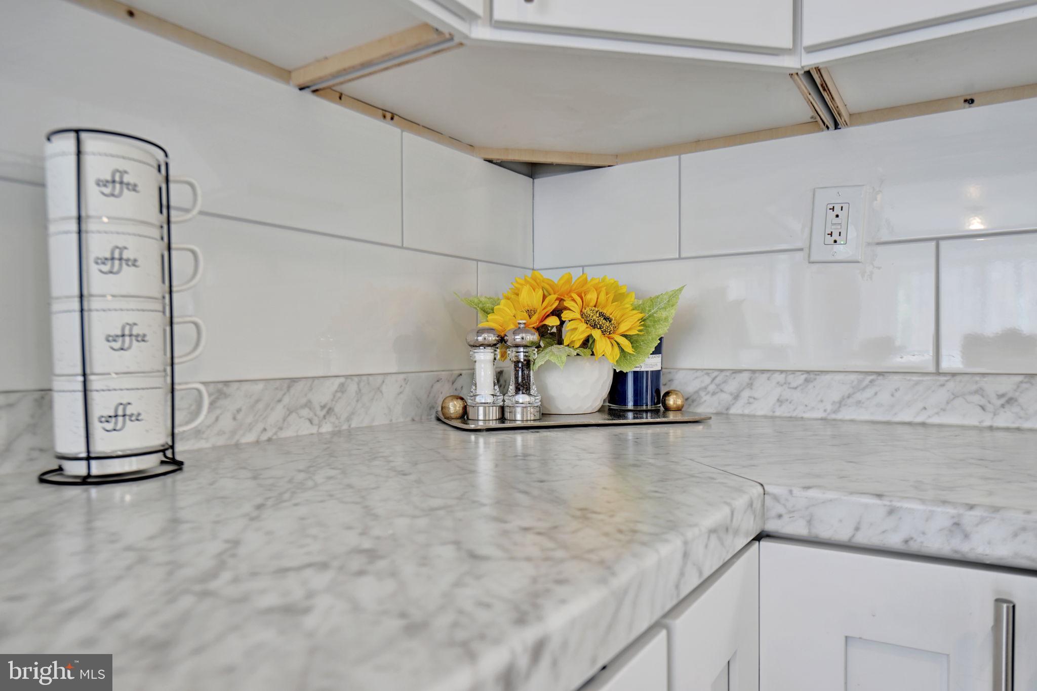 3005 7th Street Southeast Washington, DC 20032 - Photo 17 of 56 a kitchen with a sink a stove and cabinets