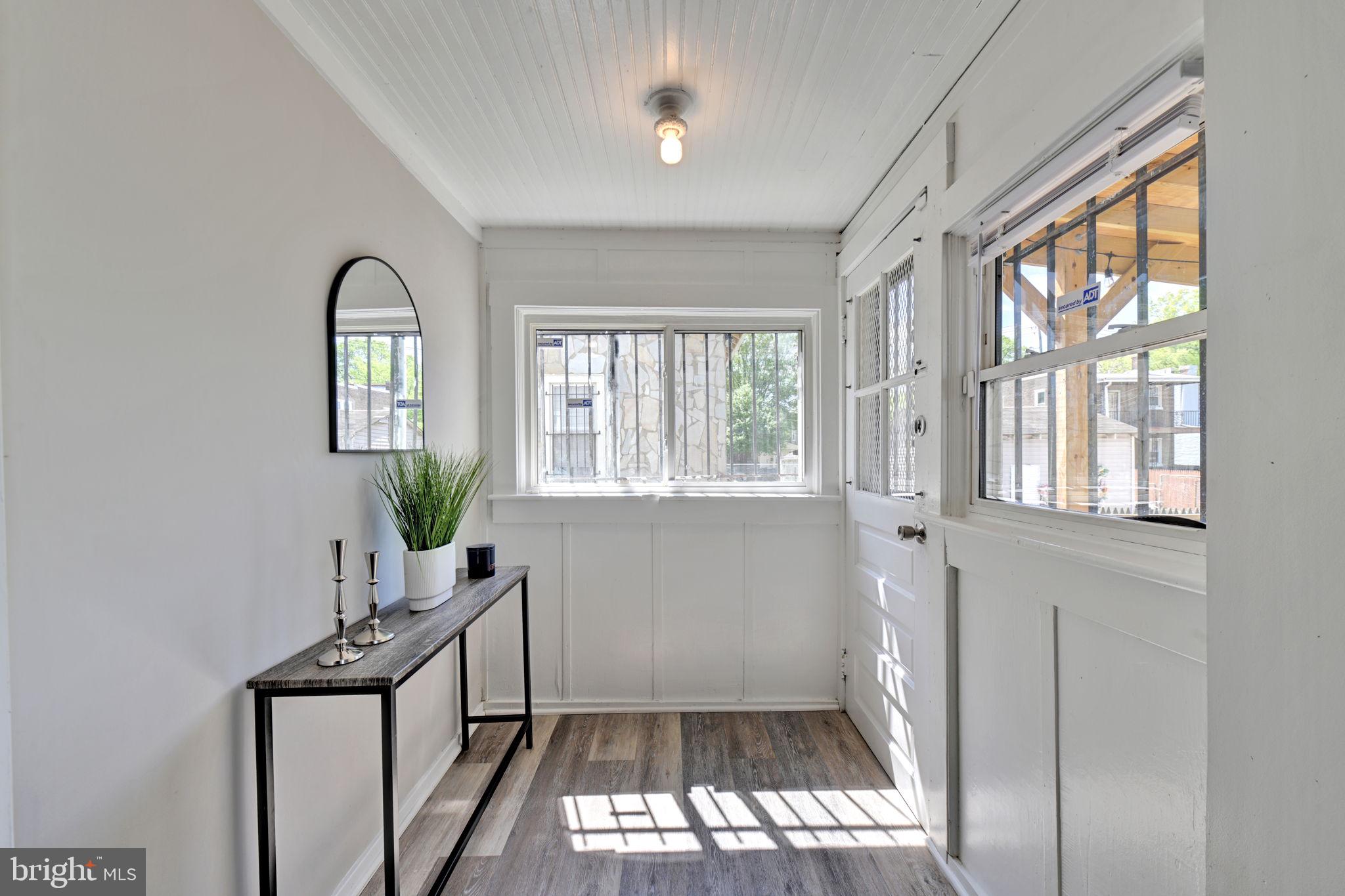 3005 7th Street Southeast Washington, DC 20032 - Photo 24 of 56 wooden floor in an empty room with a window