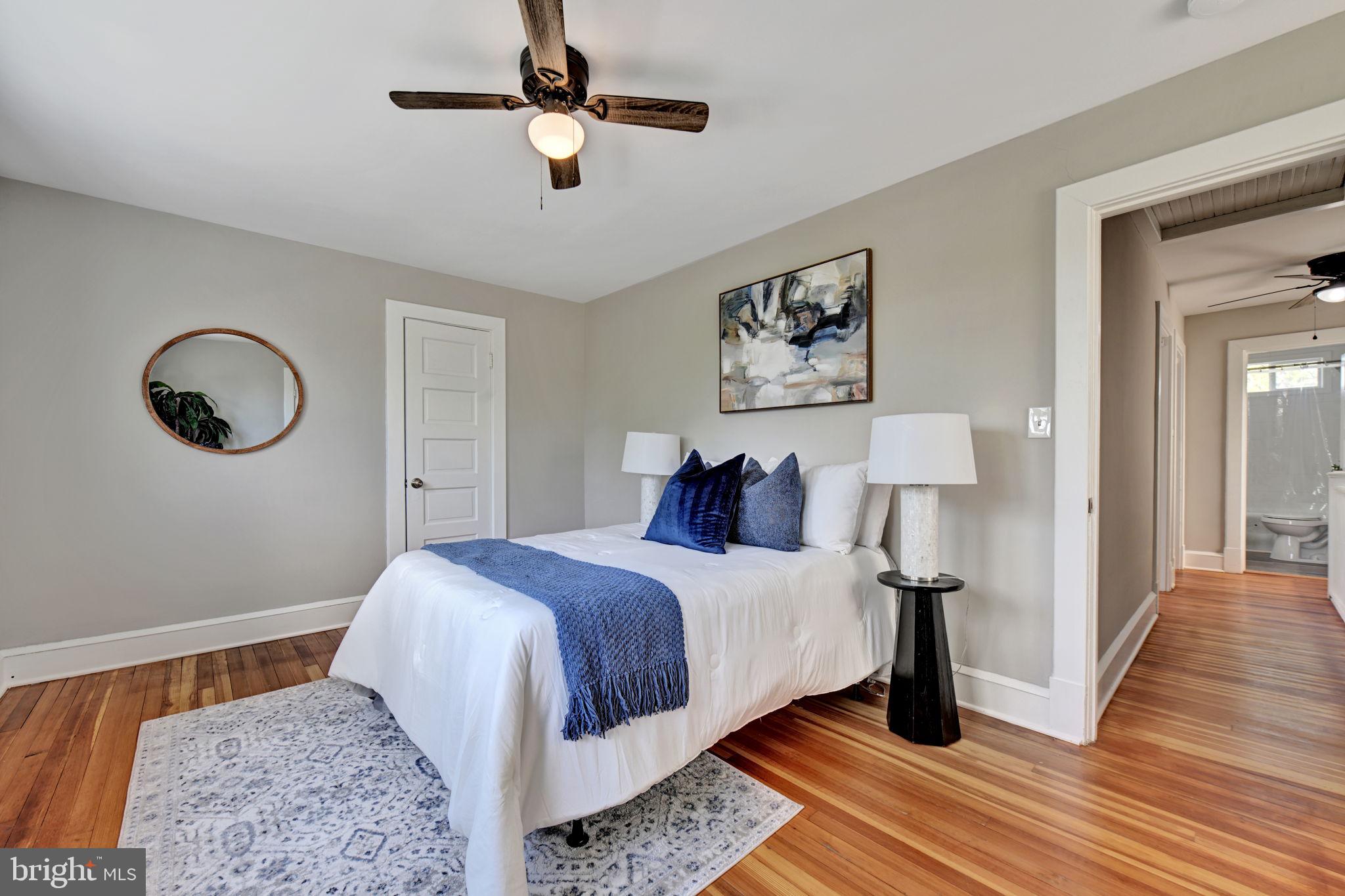 3005 7th Street Southeast Washington, DC 20032 - Photo 27 of 56 a bedroom with a bed and a lamp on dresser