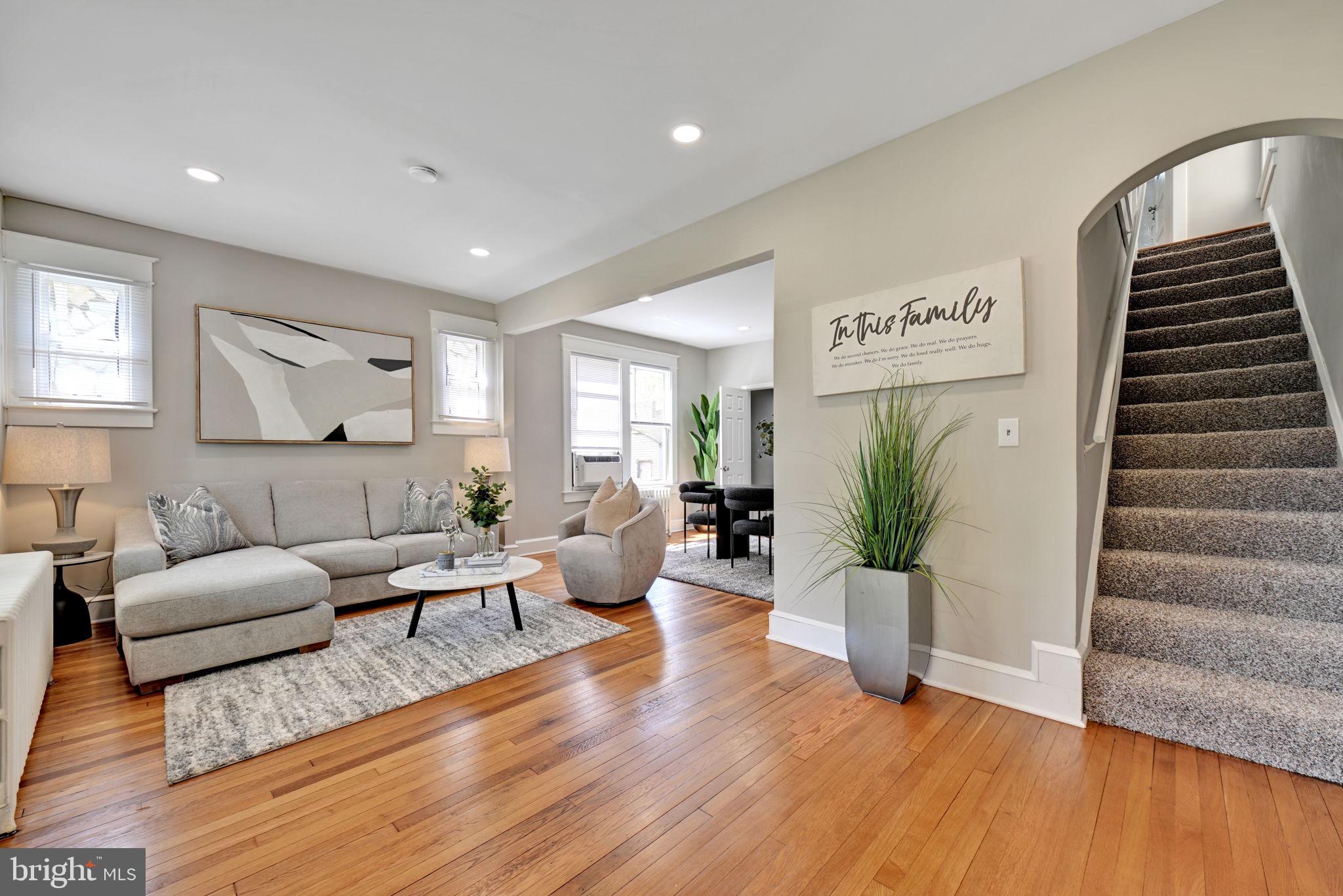 3005 7th Street Southeast Washington, DC 20032 - Photo 3 of 56 a living room with furniture and wooden floor