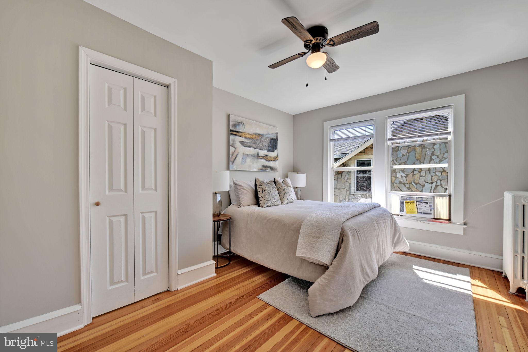 3005 7th Street Southeast Washington, DC 20032 - Photo 34 of 56 a spacious bedroom with a bed and a window