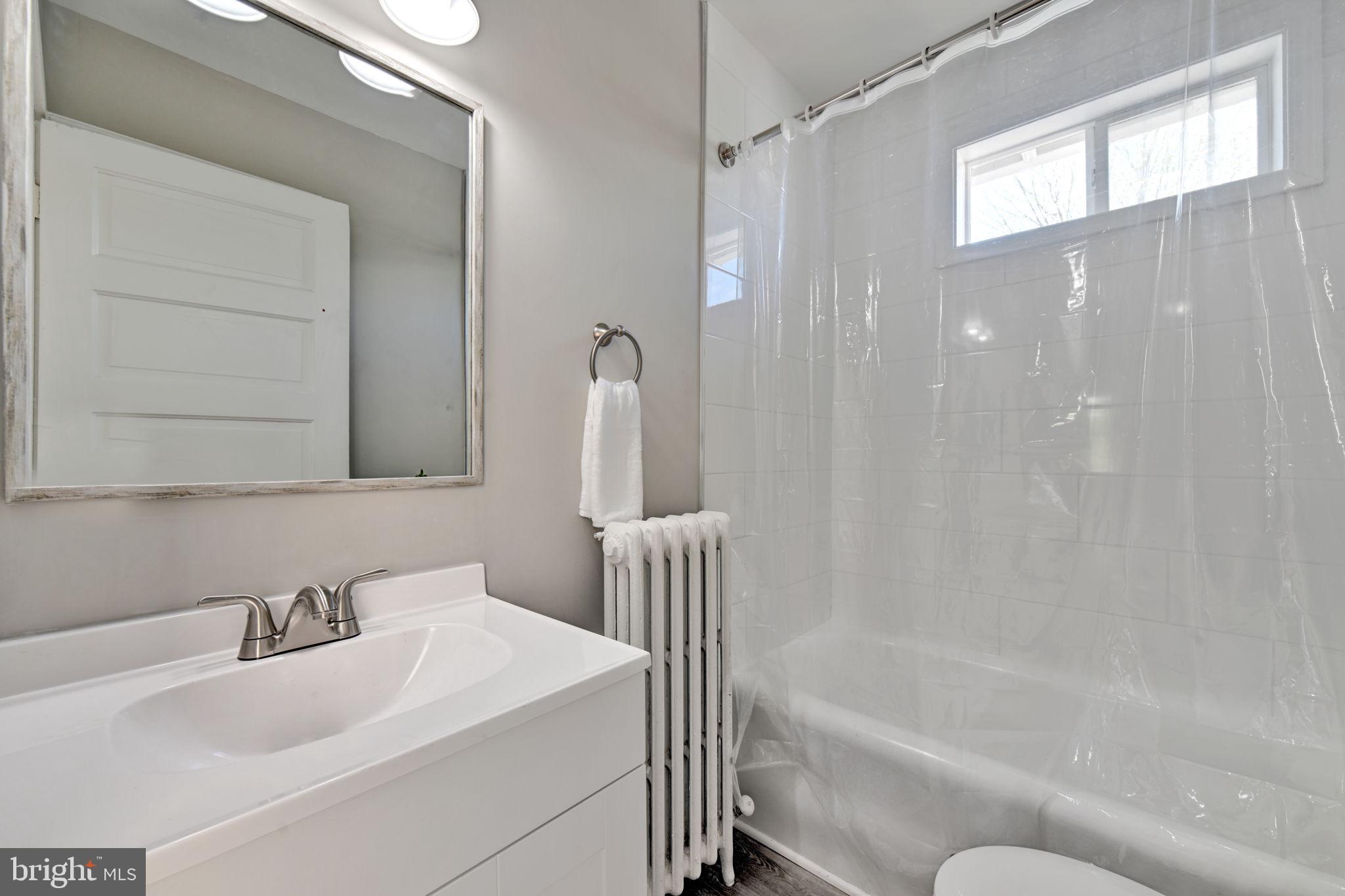 3005 7th Street Southeast Washington, DC 20032 - Photo 35 of 56 a bathroom with a sink and a bathtub