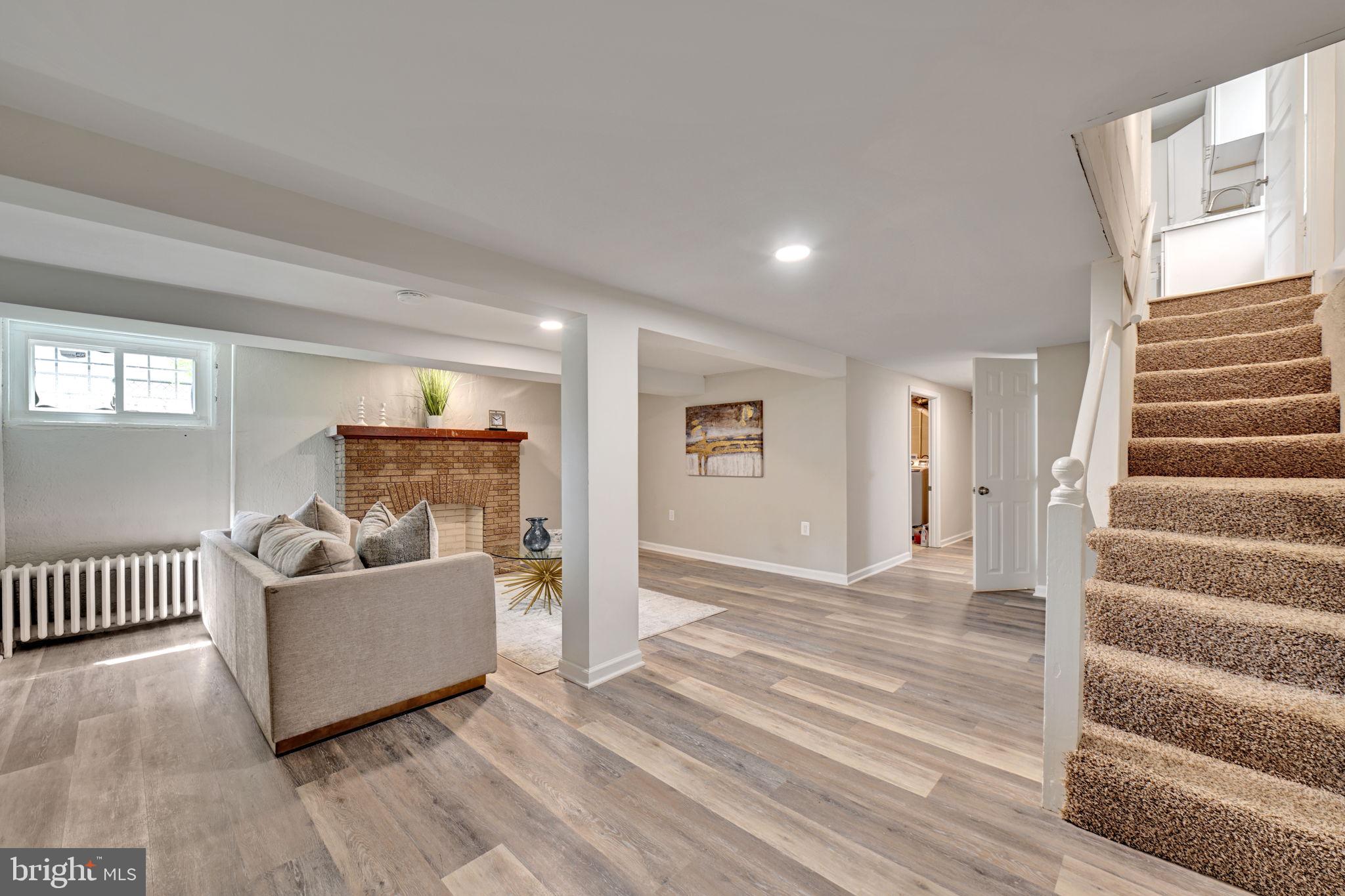 3005 7th Street Southeast Washington, DC 20032 - Photo 36 of 56 a living room with furniture and a wooden floor