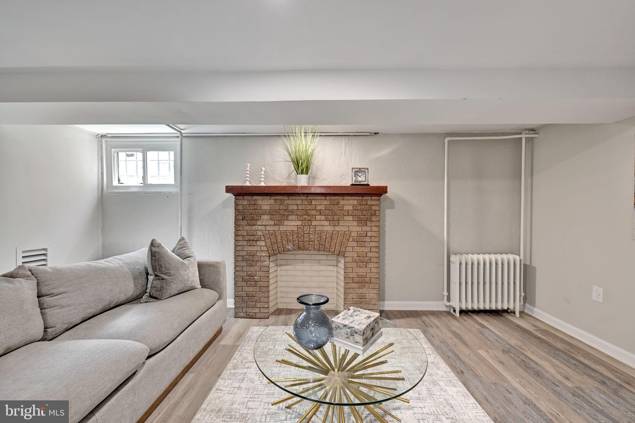 3005 7th Street Southeast Washington, DC 20032 - Photo 37 of 56 a living room with furniture and a fireplace