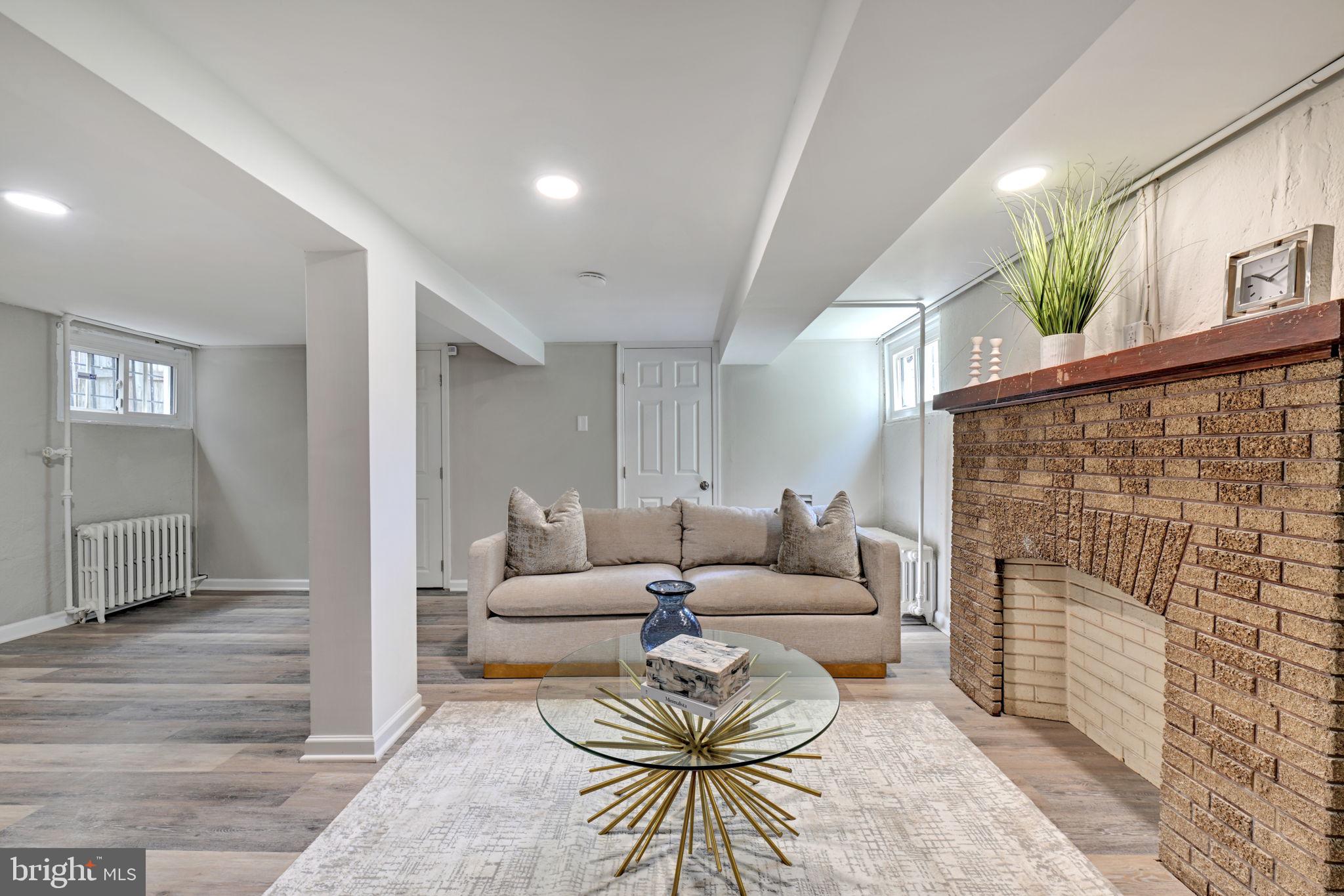 3005 7th Street Southeast Washington, DC 20032 - Photo 39 of 56 a living room with fireplace furniture and a rug