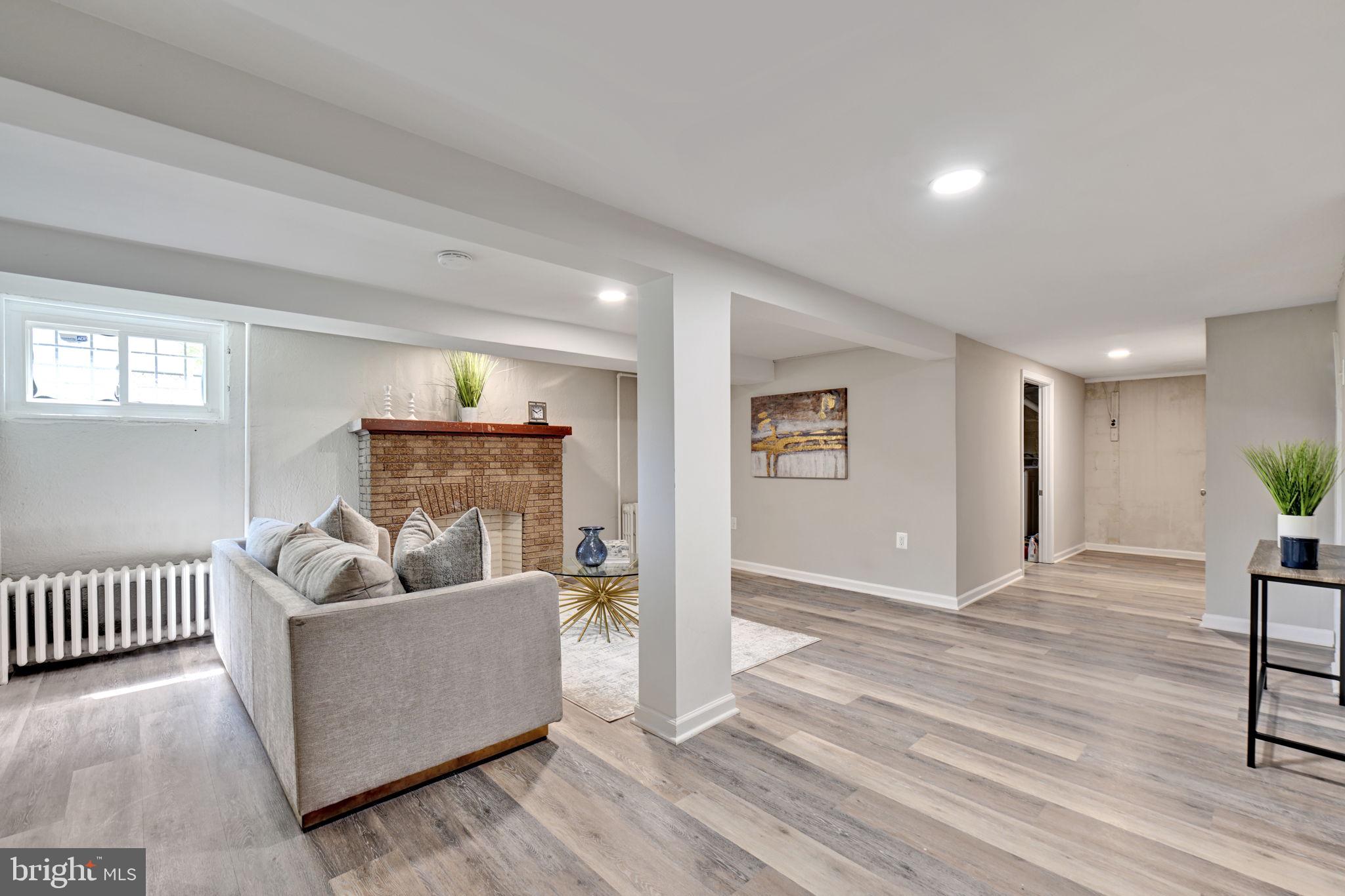 3005 7th Street Southeast Washington, DC 20032 - Photo 41 of 56 a living room with furniture and a wooden floor