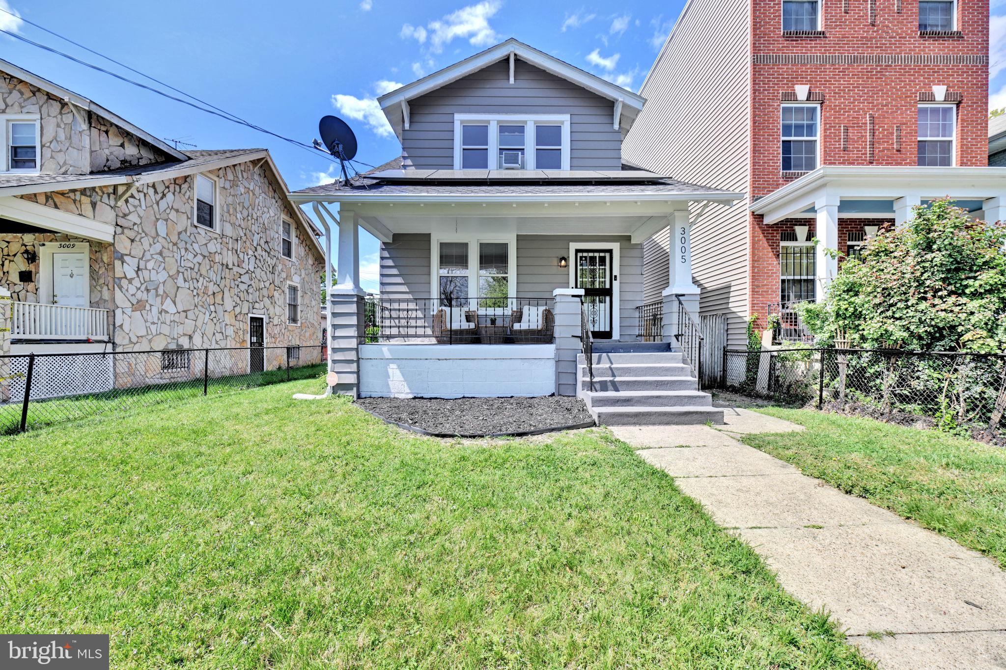 3005 7th Street Southeast Washington, DC 20032 - Photo 48 of 56 front view of a house with a yard