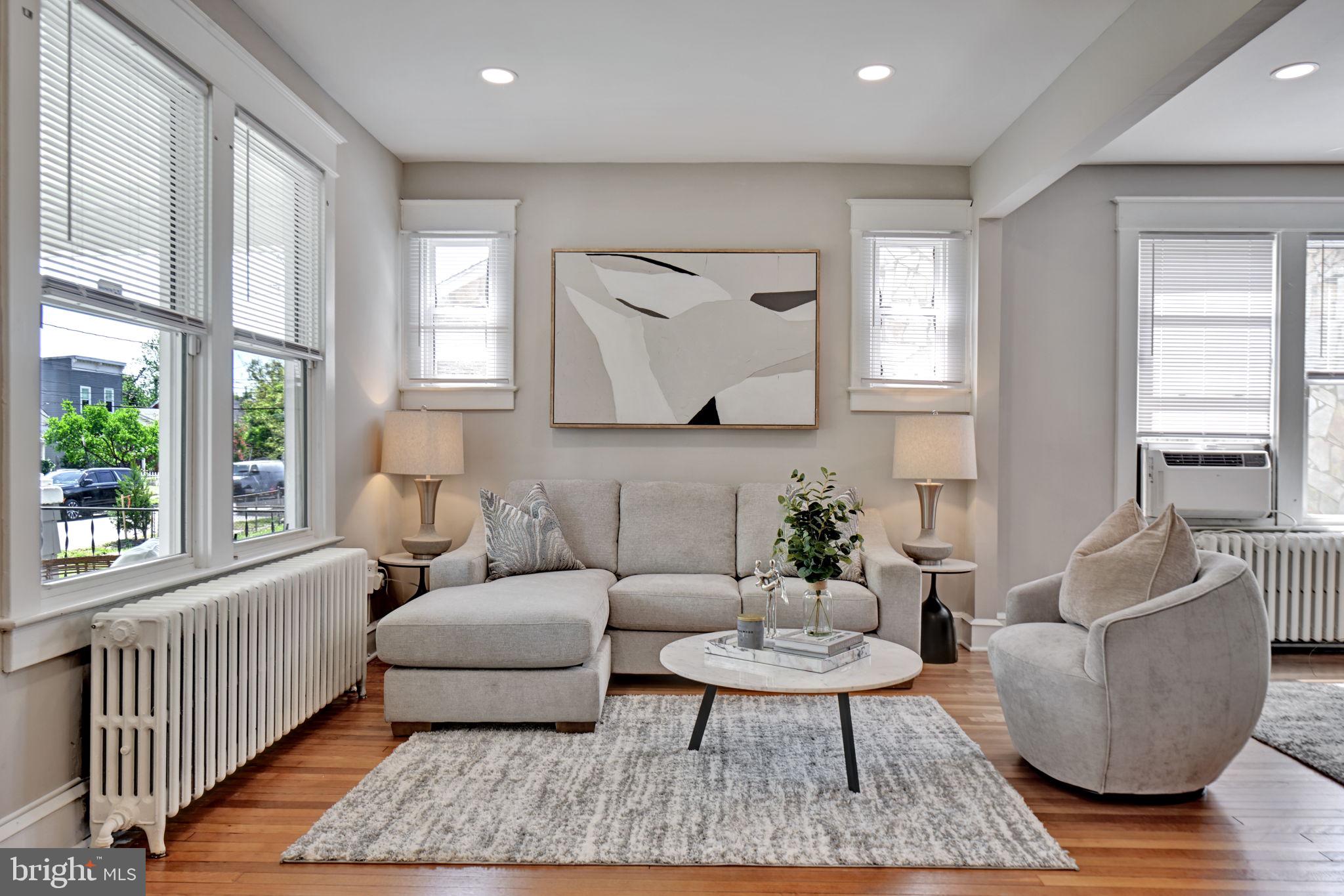 3005 7th Street Southeast Washington, DC 20032 - Photo 5 of 56 a living room with furniture and a large window