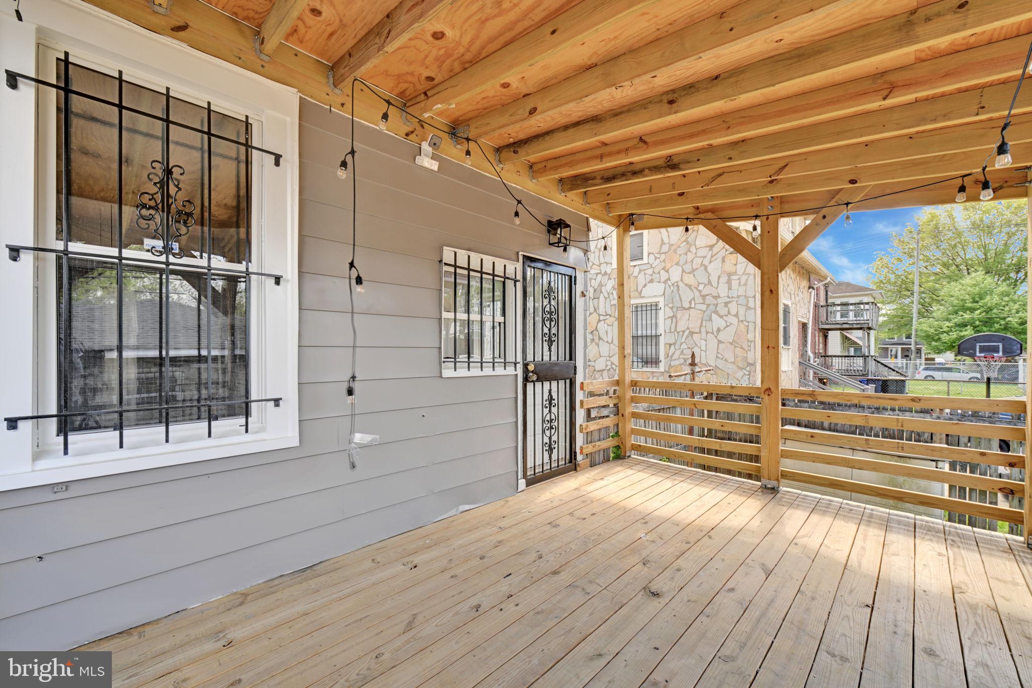 3005 7th Street Southeast Washington, DC 20032 - Photo 51 of 56 a view of empty room with wooden floor and fan