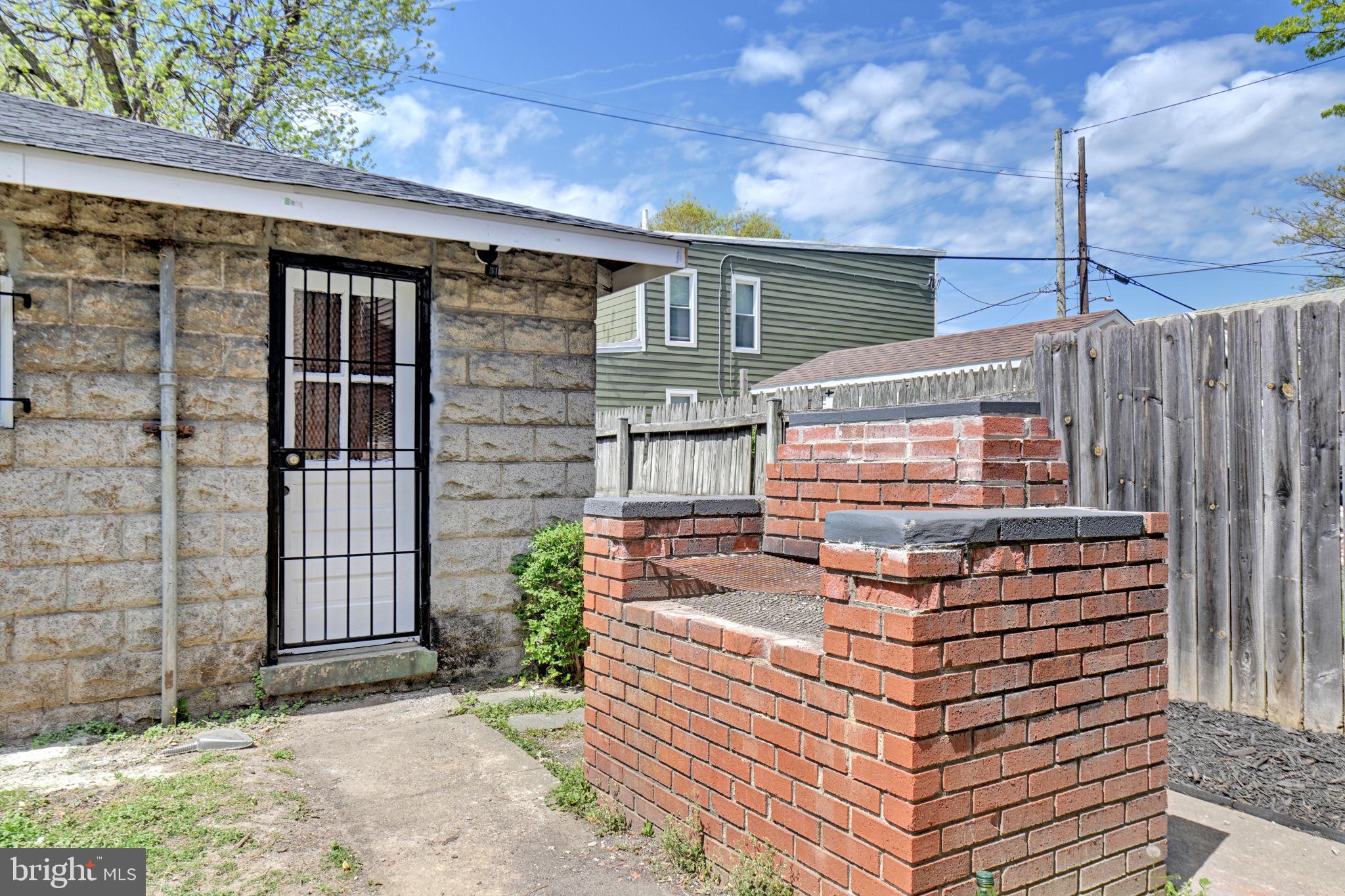 3005 7th Street Southeast Washington, DC 20032 - Photo 54 of 56 a front view of a house with a garden