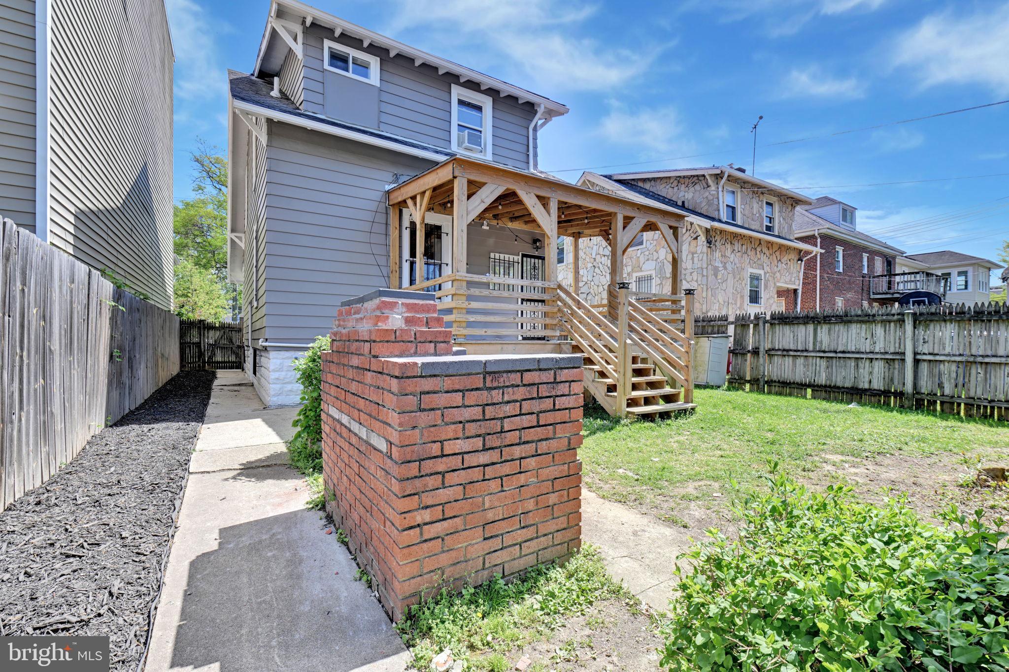 3005 7th Street Southeast Washington, DC 20032 - Photo 55 of 56 a front view of a house with a yard