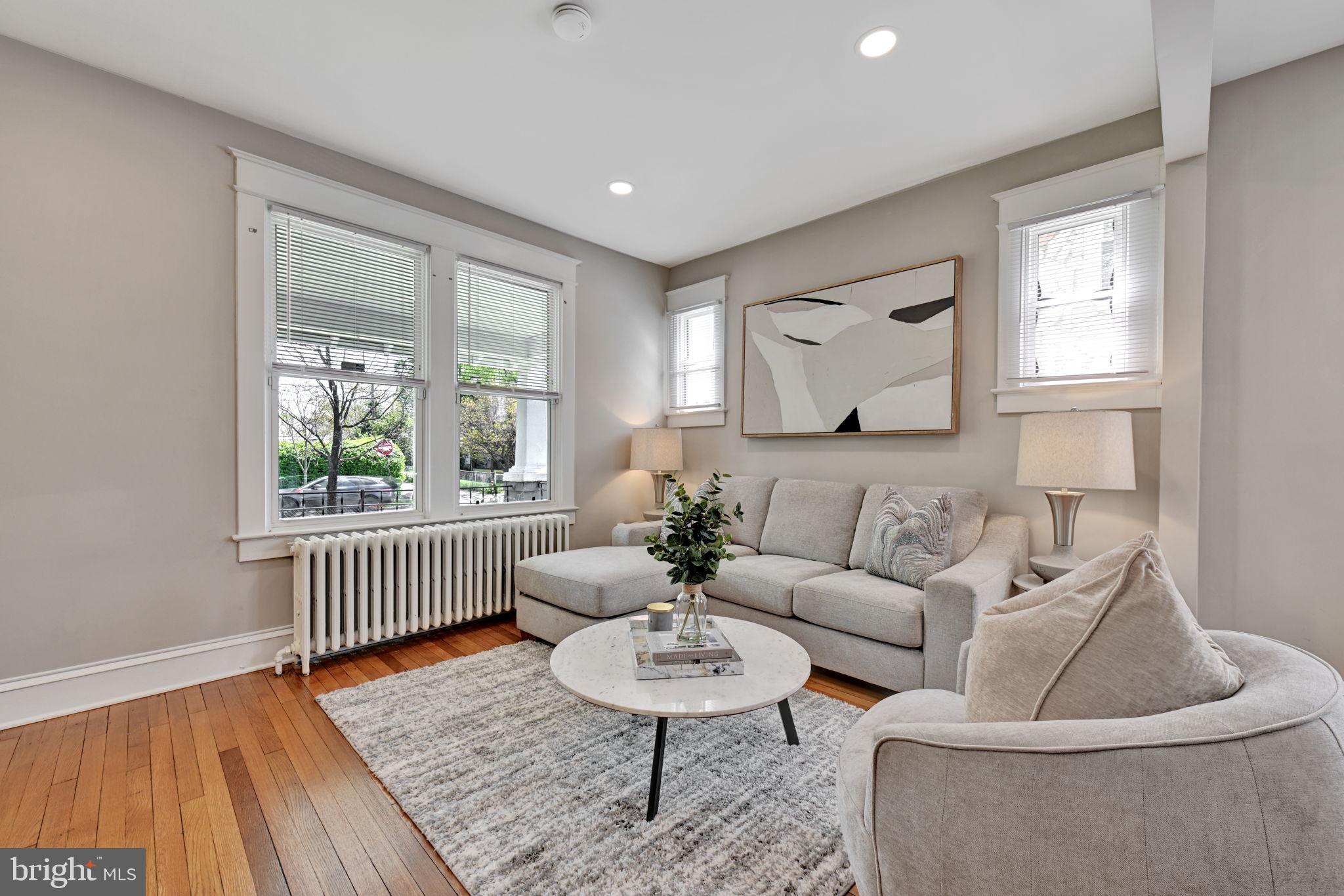 3005 7th Street Southeast Washington, DC 20032 - Photo 6 of 56 a living room with furniture and a wooden floor