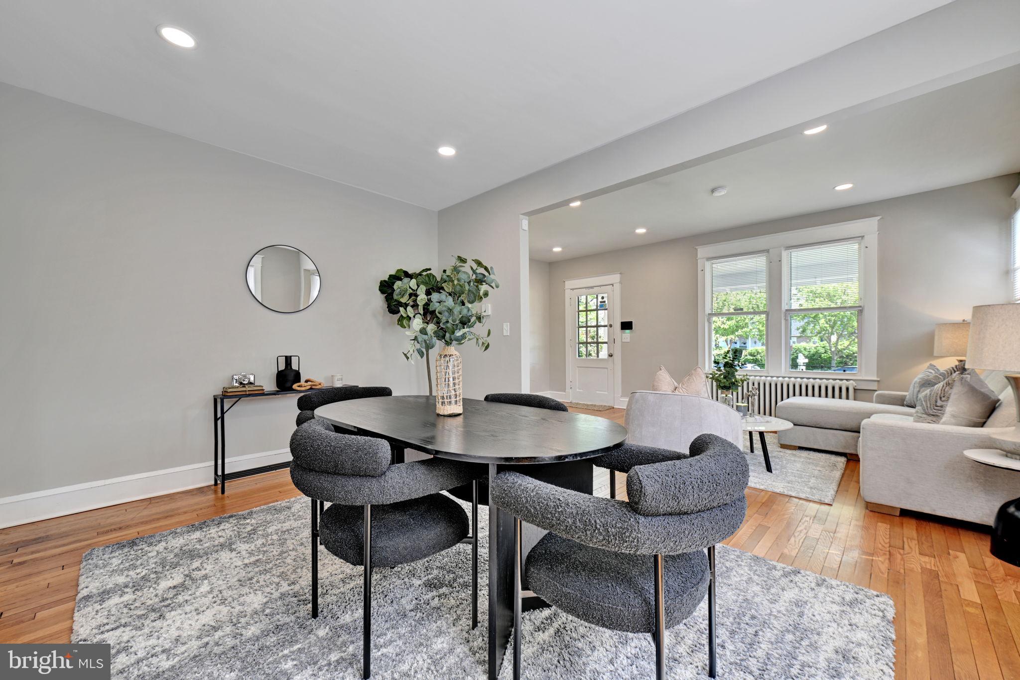 3005 7th Street Southeast Washington, DC 20032 - Photo 10 of 56 a dining room with furniture and wooden floor