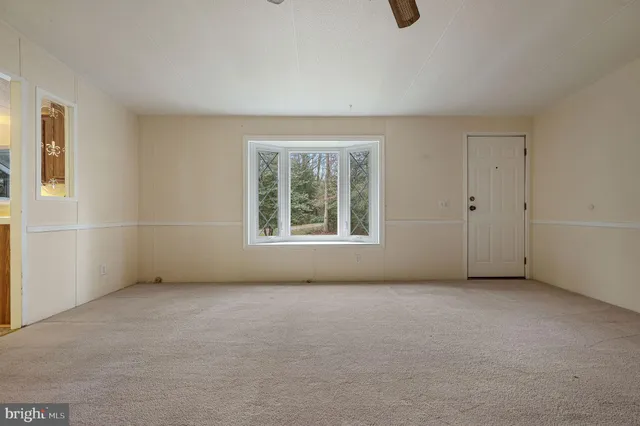 a view of an empty room with windows