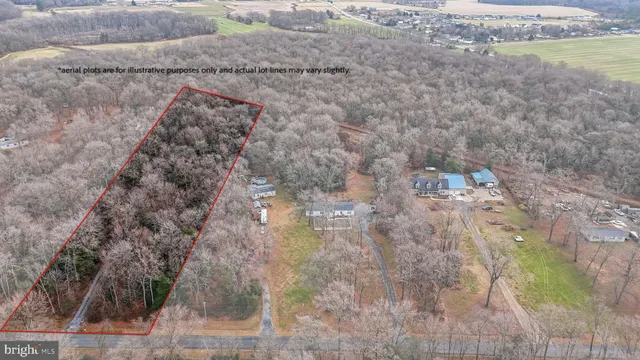a aerial view of a house with a yard