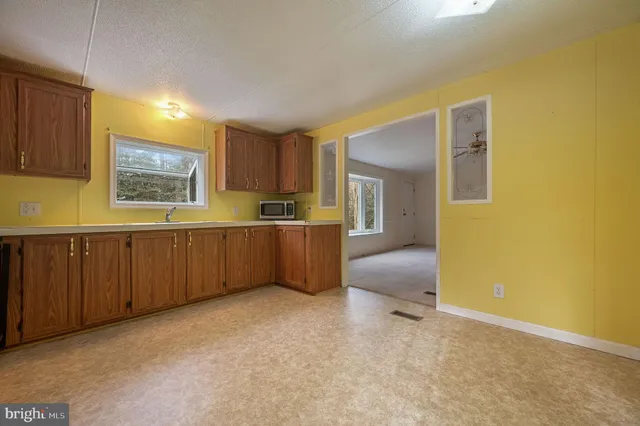a view of a kitchen with furniture and window
