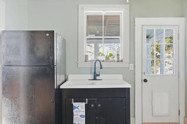 a sink sitting next to a window